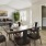 a living room with a table and chairs