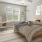 a bedroom with a bed and a fan