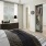 a bedroom with a bed and a fan