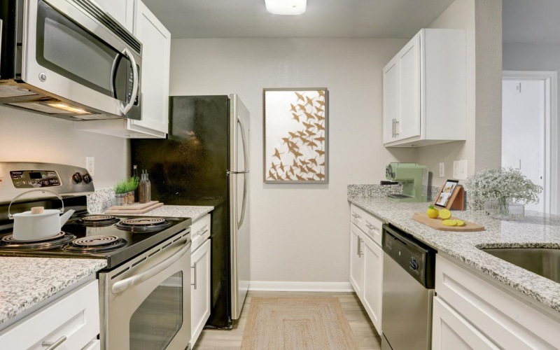 a kitchen with white cabinets