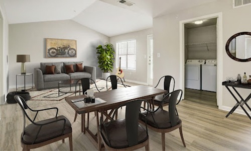 dining and living room with table chairs and a couch